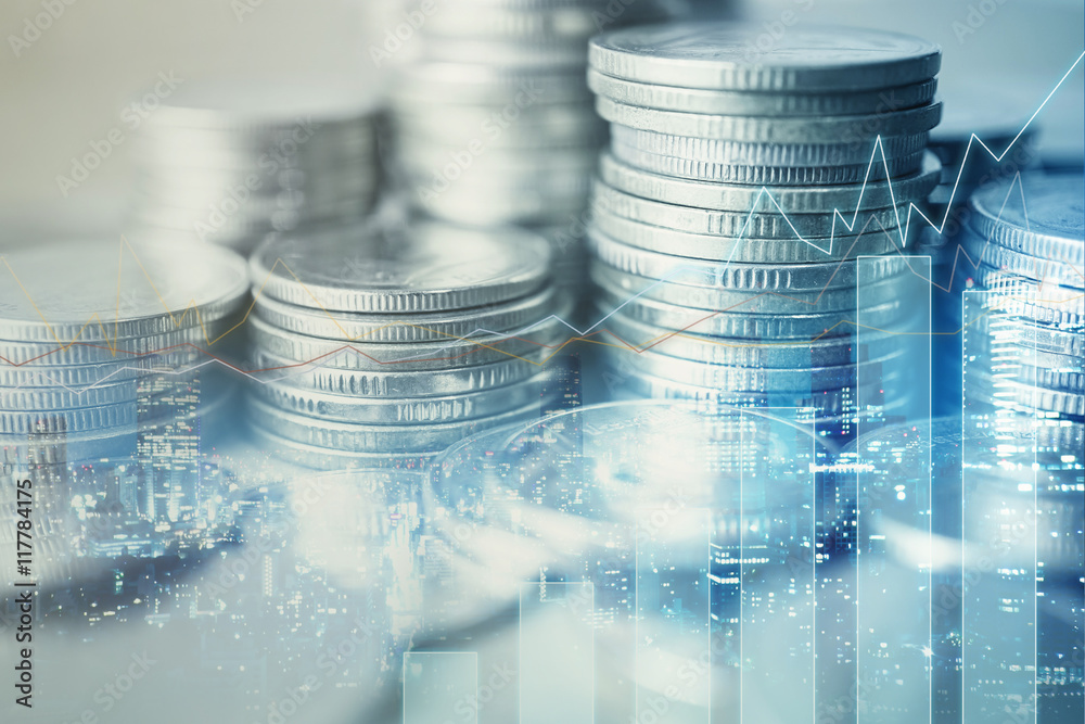 Double exposure of city and rows of coins for finance and banking concept