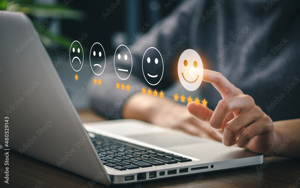 User give rating to service experience on online application for Customer review satisfaction feedback survey concept.